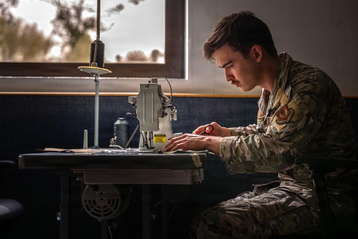 Rigger sewing at an industrial sewing machine